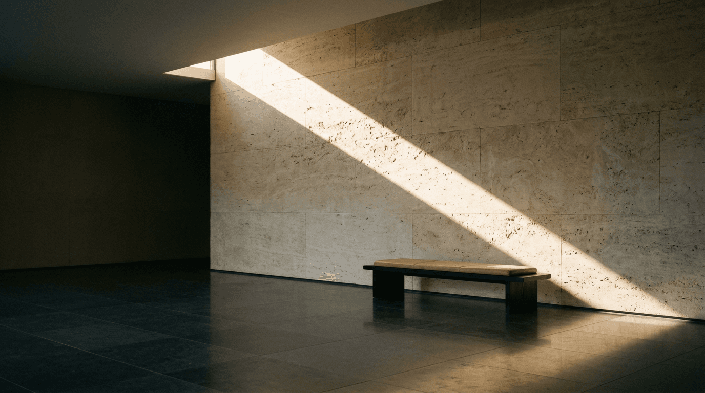 Stone lobby wall with a shaft of afternoon light
